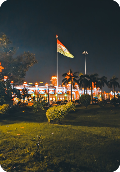 Indian flag at night with illuminated building